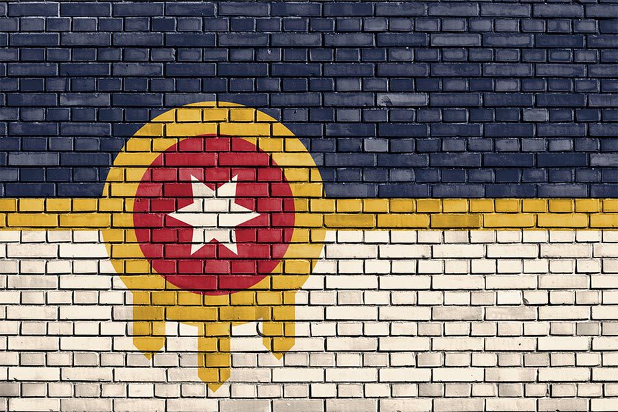 Tulsa, OK Insurance - Flag of Tulsa, Oklahoma Painted on a Brick Wall